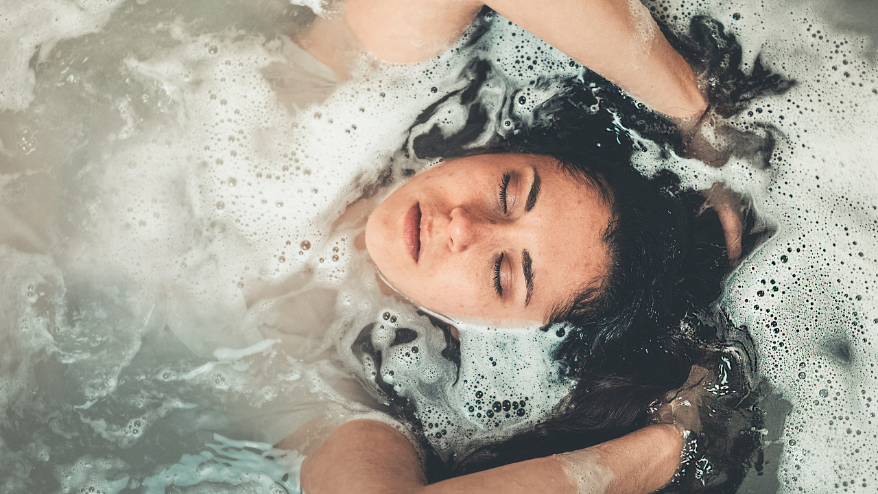 Woman Soaking In a Tub - Self Care | Weight Loss Coach and Nutritionist