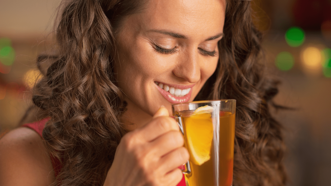 Woman drinking tea for gut health