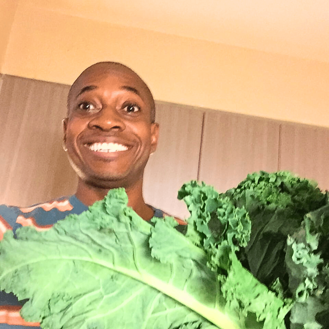 Chris Walker Holding Kale | Weight Loss Coach and Nutritionist