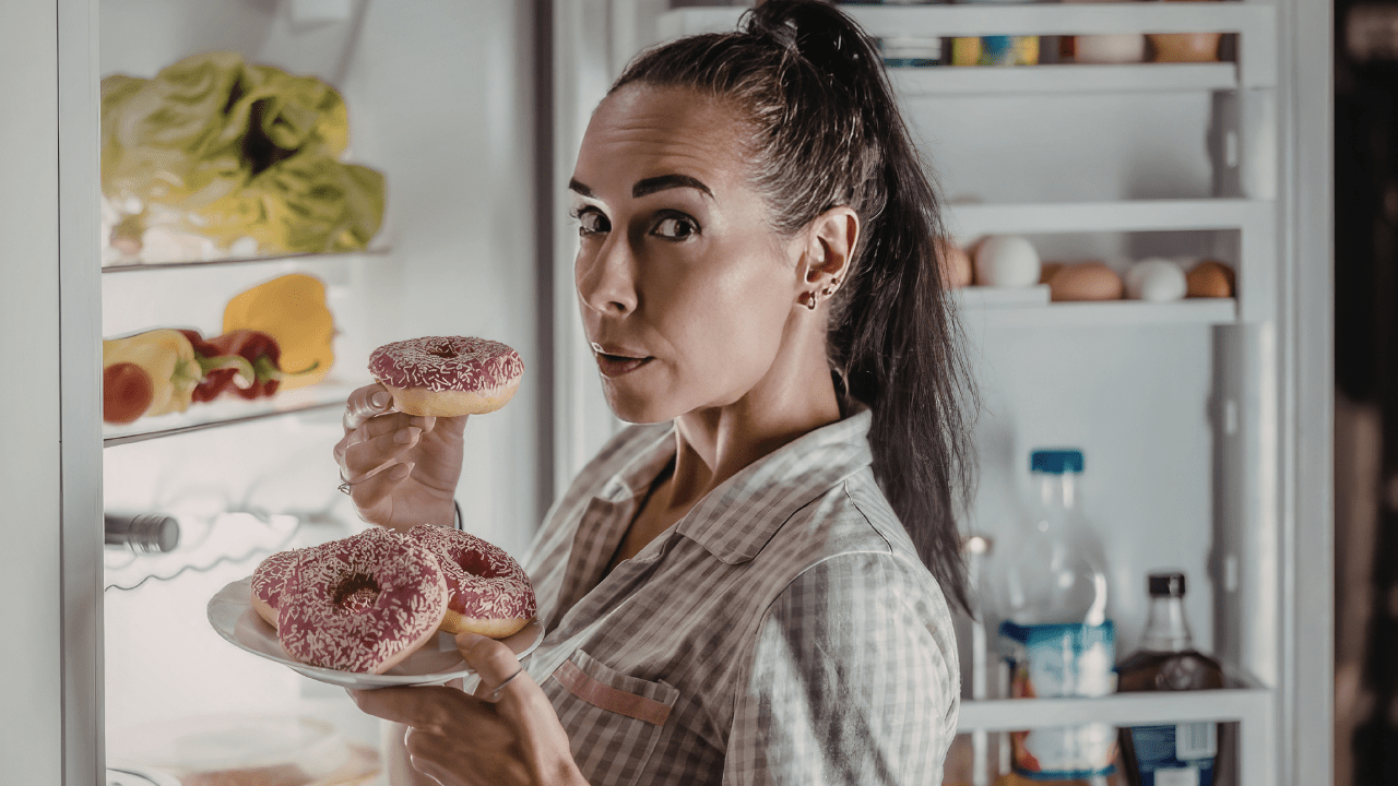 Woman Snacking at Night - Cheating on Weight Loss Diet