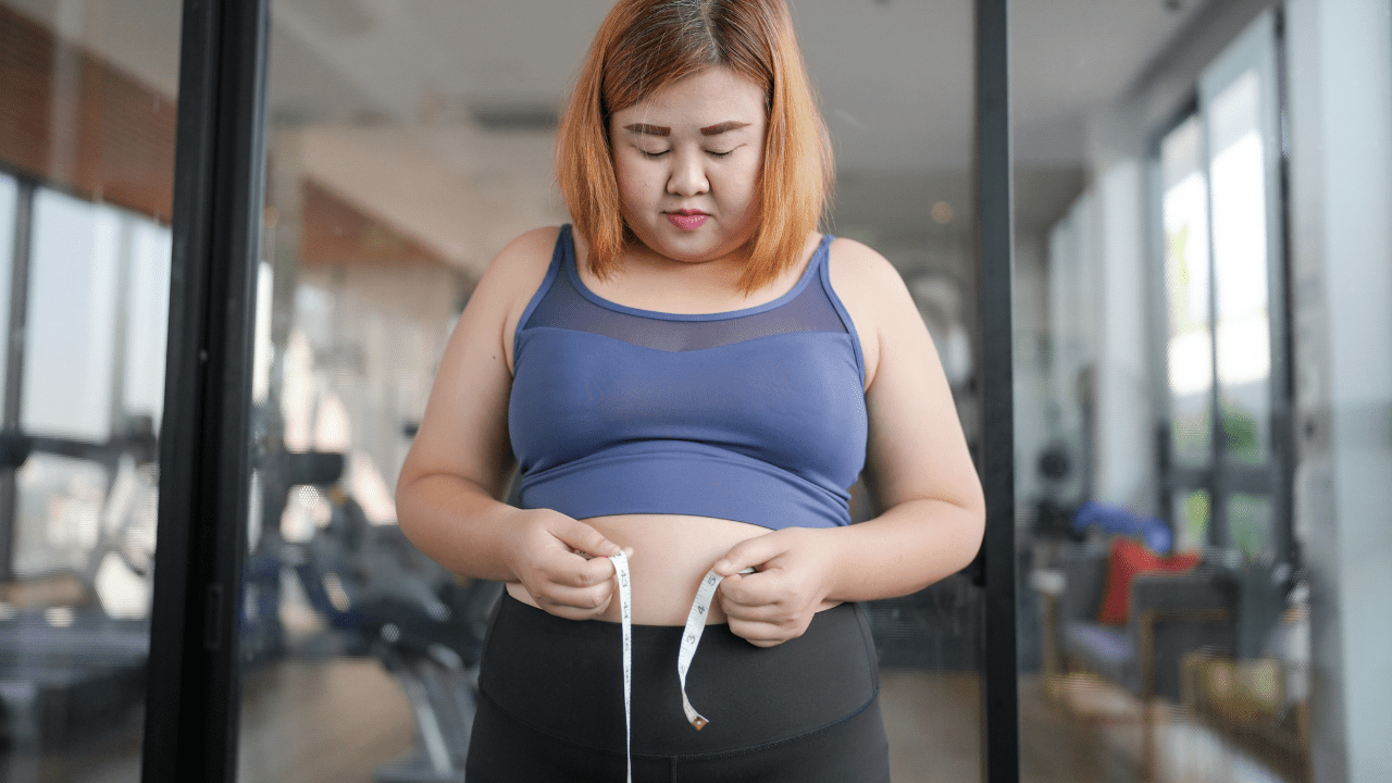 Woman Measuring Belly Fat